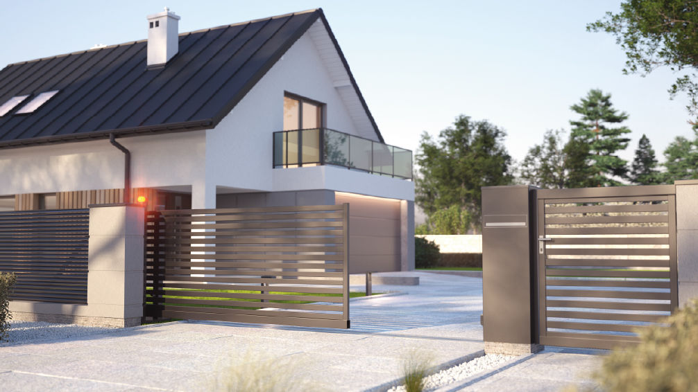 un portail coulissant en aluminium devant une maison contemporaine